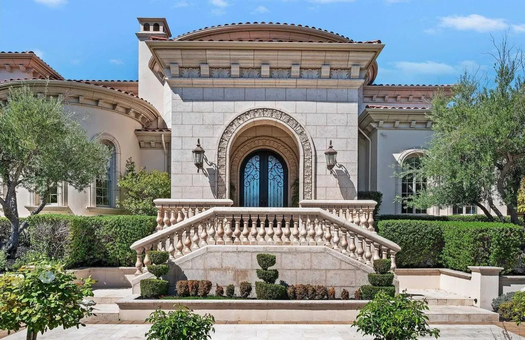 Inside a $13.5 Million Mediterranean Mansion in Ruby Hill, Pleasanton 2 Grand stone entrance of the Mediterranean estate at 1515 Germano Way in Ruby Hill, featuring ornate double doors, curved staircases, and luxury landscaping.