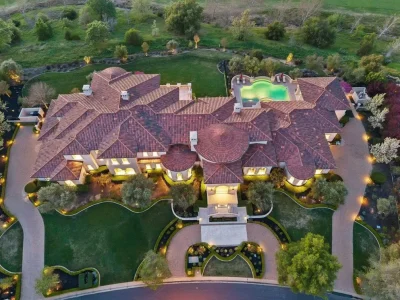 Inside a $13.5 Million Mediterranean Mansion in Ruby Hill, Pleasanton 1 Aerial view of the Mediterranean estate at 1515 Germano Way in Ruby Hill, Pleasanton, featuring expansive grounds, resort-style pool, and circular motor court.