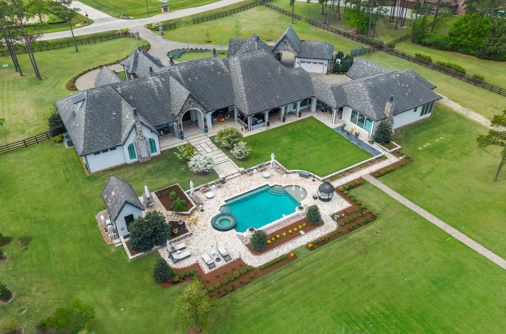A Multigenerational Texas Estate in Tomball Lists for $6,000,000 With Resort Grounds and Private Guest Residence 8 Aerial view of luxury estate with resort-style pool at 5 Willowcreek Ranch Dr in Tomball TX