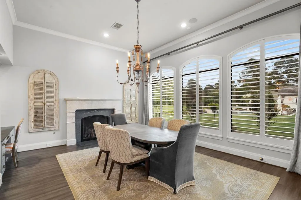 A Multigenerational Texas Estate in Tomball Lists for $6,000,000 With Resort Grounds and Private Guest Residence 7 Private dining room with fireplace and plantation shutters at 5 Willowcreek Ranch Dr in Tomball TX