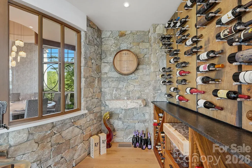 Lake Norman’s Ultimate Peninsula Estate Lists for $18,500,000 in Norman Estates 8 Custom wine cellar at 8515 Norman Estates Dr luxury waterfront estate on Lake Norman