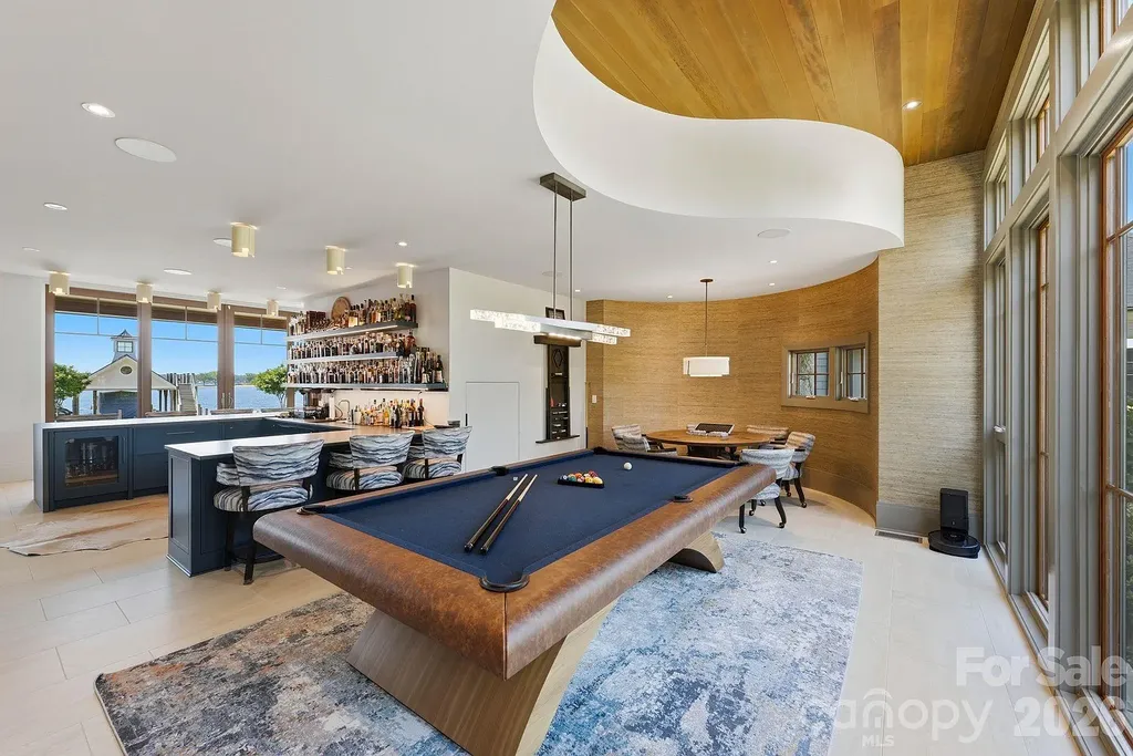 Lake Norman’s Ultimate Peninsula Estate Lists for $18,500,000 in Norman Estates 7 Luxury game room with billiards table and entertainment bar at 8515 Norman Estates Dr