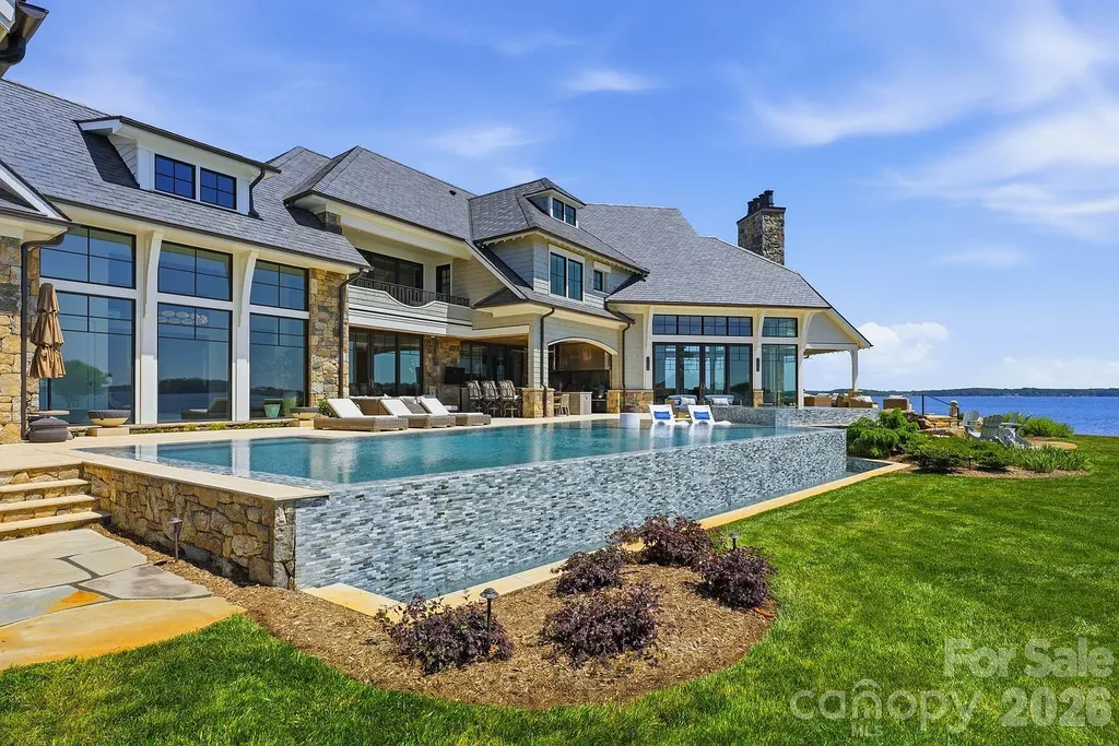 Lake Norman’s Ultimate Peninsula Estate Lists for $18,500,000 in Norman Estates 3 Infinity edge pool at 8515 Norman Estates Dr luxury Lake Norman waterfront estate in Denver NC