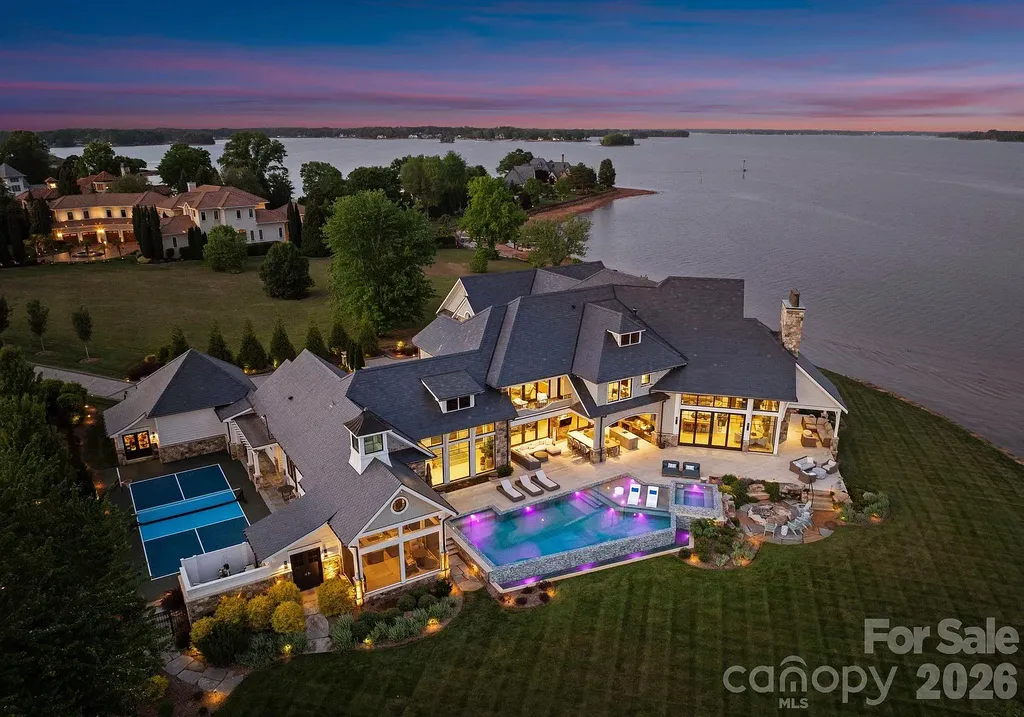 Lake Norman’s Ultimate Peninsula Estate Lists for $18,500,000 in Norman Estates 14 Aerial twilight view of the waterfront estate at 8515 Norman Estates Dr on Lake Norman
