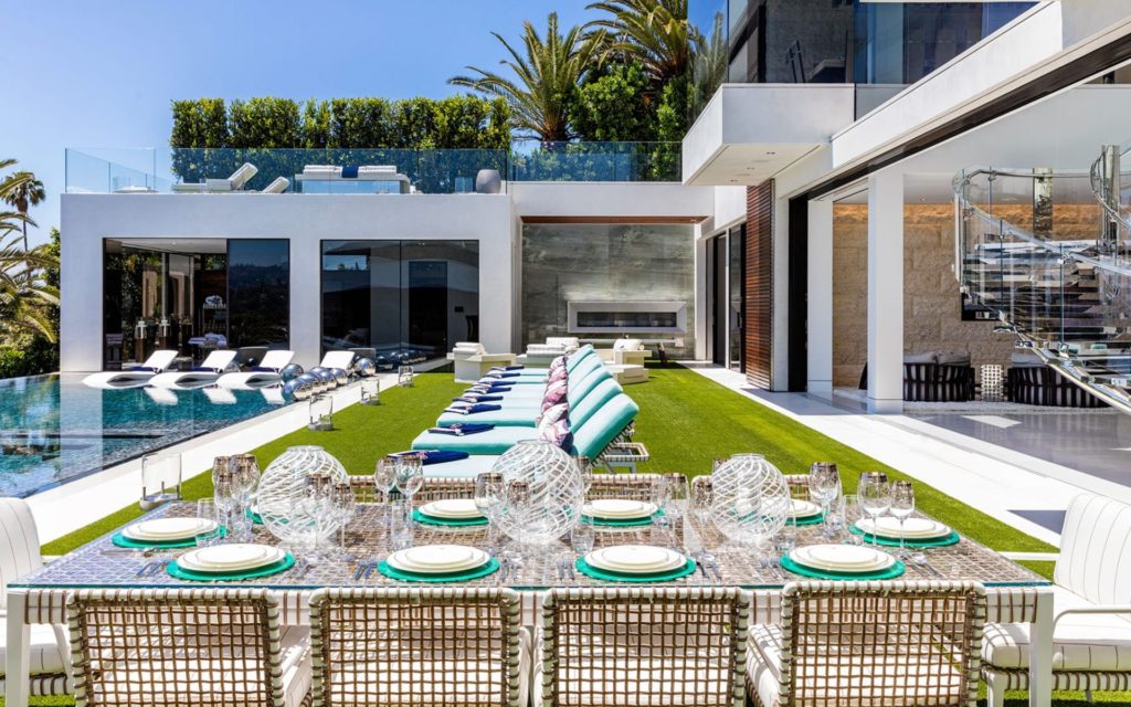 Modern Mansions in California: Where Design, Power, and Global Wealth Converge 5 luxury outdoor dining and pool area at 924 Bel Air Road mansion in Los Angeles