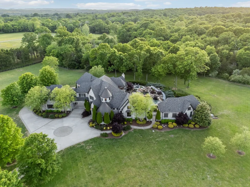 Inside a $12 Million Tennessee Estate With 62 Private Acres and Resort Amenities 16 Aerial view of a private luxury estate in College Grove Tennessee surrounded by wooded acreage and open countryside