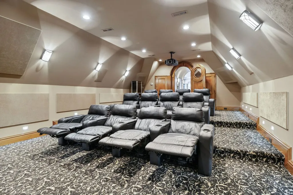 Inside a $12 Million Tennessee Estate With 62 Private Acres and Resort Amenities 5 Private home theater inside a luxury estate in College Grove Tennessee featuring reclining leather seating and dedicated cinema design