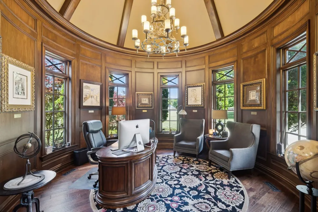 Inside a $12 Million Tennessee Estate With 62 Private Acres and Resort Amenities 9 Private office inside a luxury estate in College Grove Tennessee featuring wood-paneled walls, curved architecture, and executive workspace design