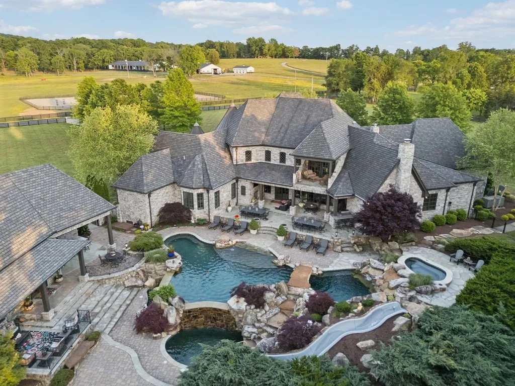 Inside a $12 Million Tennessee Estate With 62 Private Acres and Resort Amenities 14 Aerial view of a luxury estate in College Grove Tennessee featuring a resort-style pool, spa, outdoor entertaining areas, and expansive acreage