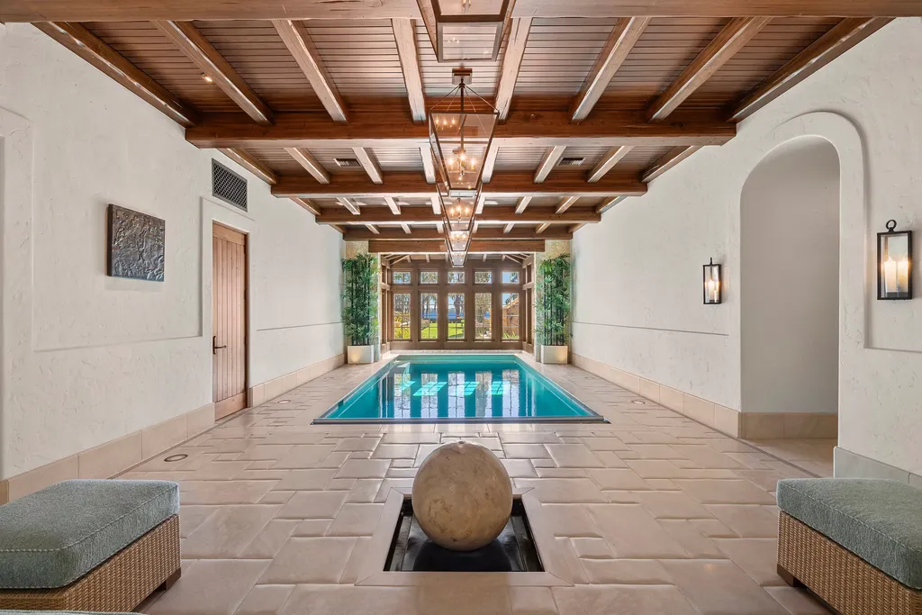 Inside Florida’s Most Ambitious Private Estate: The Oaks Emerges as a $115 Million Benchmark in Tampa Bay 12 Indoor pool at The Oaks Estate with lake views and wood beam ceiling in Tampa, Florida