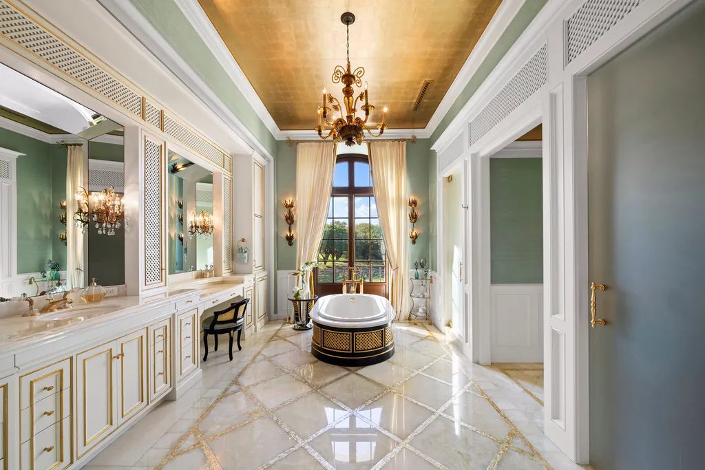 Inside Florida’s Most Ambitious Private Estate: The Oaks Emerges as a $115 Million Benchmark in Tampa Bay 8 Luxury bathroom at The Oaks Estate featuring marble floors, freestanding tub, and chandelier in Tampa, Florida