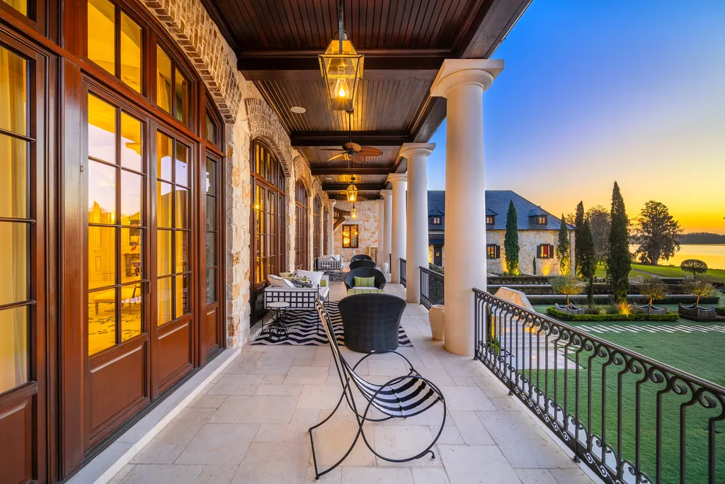 Inside Florida’s Most Ambitious Private Estate: The Oaks Emerges as a $115 Million Benchmark in Tampa Bay 14 Covered terrace balcony at The Oaks Estate overlooking landscaped grounds and Lake Thonotosassa in Tampa, Florida
