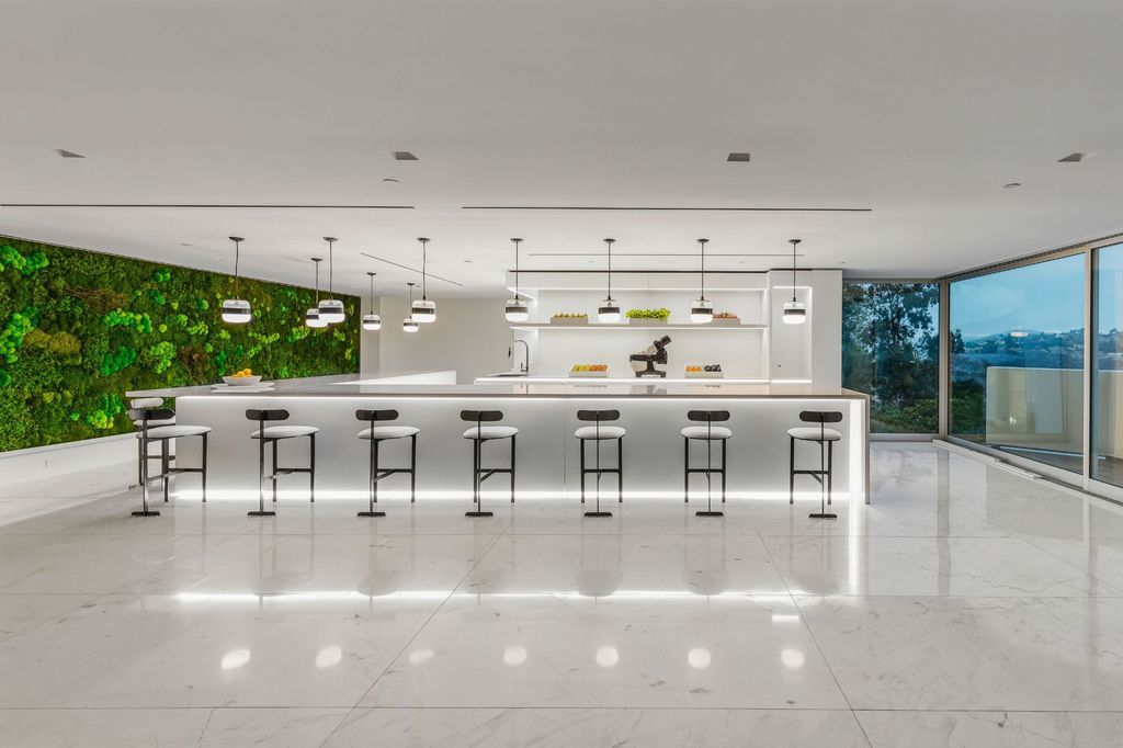 Modern Mansions in California: Where Design, Power, and Global Wealth Converge 3 modern mansion kitchen in Bel Air Los Angeles with marble island and luxury bar seating