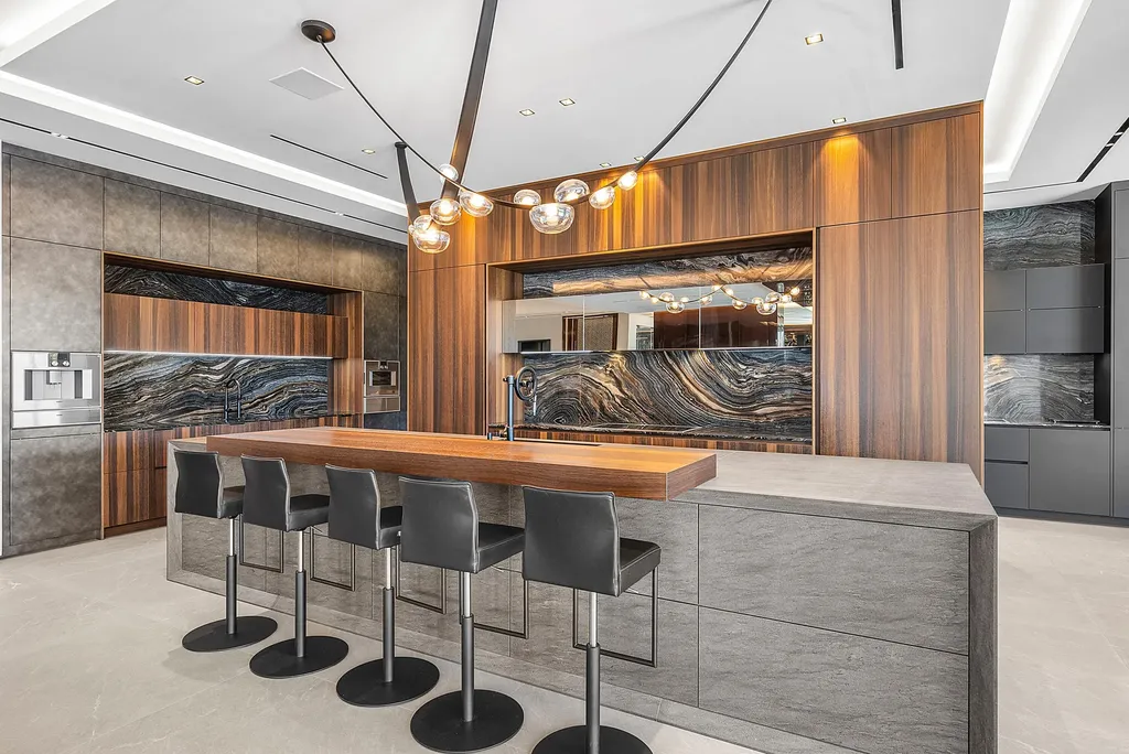 Boca Raton’s Trinity Point Estate Lists for $32.5 Million With 368 Feet of Intracoastal Frontage 7 Luxury chef's kitchen at Trinity Point Estate featuring Eggersmann cabinetry, designer stone surfaces, and premium appliances