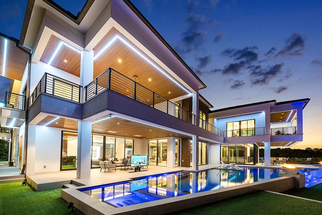 Boca Raton’s Trinity Point Estate Lists for $32.5 Million With 368 Feet of Intracoastal Frontage 10 Trinity Point Estate modern waterfront mansion in Boca Raton illuminated at dusk with infinity-edge pool and Intracoastal views