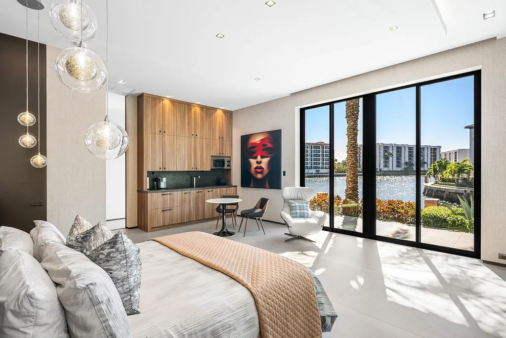 Boca Raton’s Trinity Point Estate Lists for $32.5 Million With 368 Feet of Intracoastal Frontage 6 Luxury waterfront guest suite at Trinity Point Estate featuring floor-to-ceiling glass and Intracoastal Waterway views