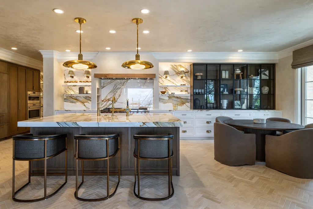 $38,500,000 Shady Canyon Estate in Irvine Blends Contemporary European Design With Nearly an Acre of Privacy 6 Chef's kitchen at 76 Golden Eagle in Shady Canyon featuring marble countertops, custom cabinetry, designer lighting, and luxury finishes