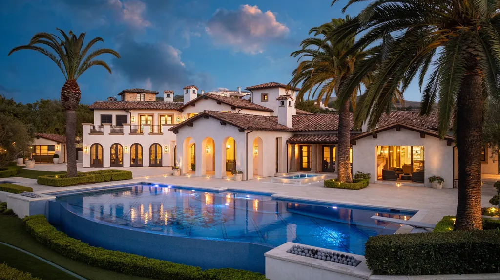 $38,500,000 Shady Canyon Estate in Irvine Blends Contemporary European Design With Nearly an Acre of Privacy 1 Luxury estate at 76 Golden Eagle in Shady Canyon Irvine featuring an infinity pool, Mediterranean-inspired architecture, and landscaped grounds at dusk