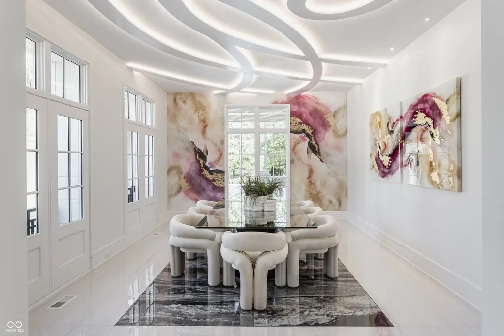 Newly Built $11.9 Million European-Inspired Estate Debuts on 14 Wooded Acres in Carmel, Indiana 6 Contemporary formal dining room with designer lighting and custom artwork inside the $11.9 million Carmel luxury estate