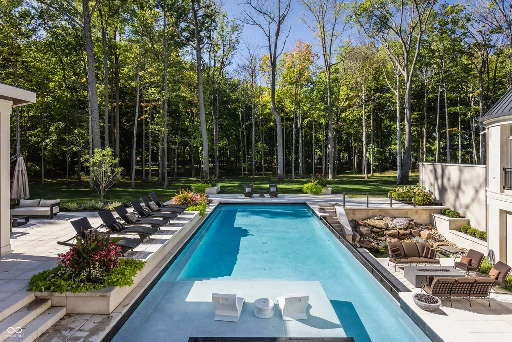 Newly Built $11.9 Million European-Inspired Estate Debuts on 14 Wooded Acres in Carmel, Indiana 14 Resort-style infinity-edge swimming pool surrounded by private wooded grounds at the $11.9 million Carmel luxury estate