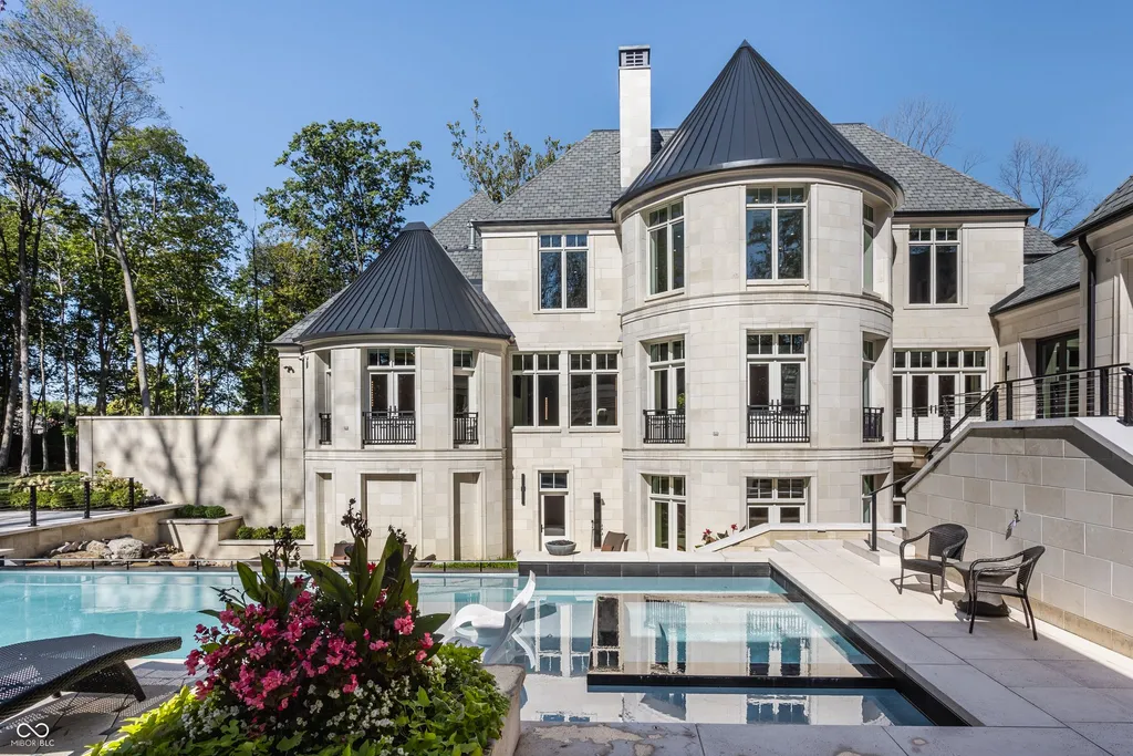 Newly Built $11.9 Million European-Inspired Estate Debuts on 14 Wooded Acres in Carmel, Indiana 13 Resort-style swimming pool overlooking the rear elevation of the $11.9 million luxury estate in Carmel, Indiana