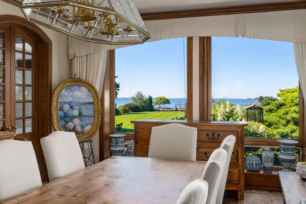 Connecticut’s Most Expensive Home Hits the Market for $100 Million: Historic Waterfront Estate Cedar Cliff Debuts in Greenwich 4 Formal dining room at Cedar Cliff estate overlooking Long Island Sound and manicured waterfront grounds in Riverside Connecticut