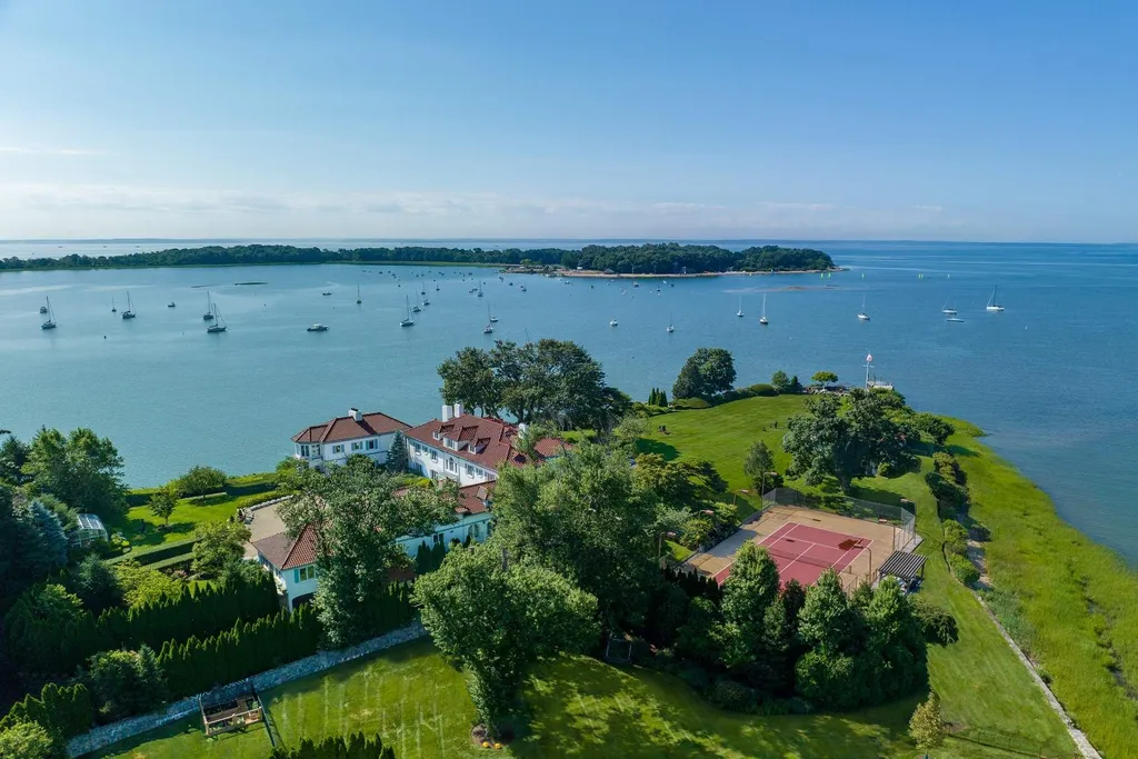 Connecticut’s Most Expensive Home Hits the Market for $100 Million: Historic Waterfront Estate Cedar Cliff Debuts in Greenwich 2 Aerial view of Cedar Cliff estate on a private waterfront peninsula with tennis court in Riverside Connecticut