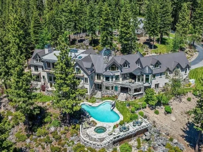 Former Home of a Rock and Roll Hall of Famer Above Lake Tahoe Lists for $43 Million 1 Aerial view of the $43 million Lake Tahoe estate in Incline Village Nevada featuring nearly 19,000 square feet, forested grounds and resort-style outdoor amenities