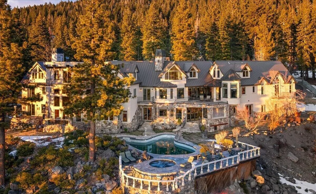 Former Home of a Rock and Roll Hall of Famer Above Lake Tahoe Lists for $43 Million 2 Exterior view of the $43 million Lake Tahoe estate in Incline Village Nevada featuring stone architecture, resort-style pool and forested mountain surroundings at sunset