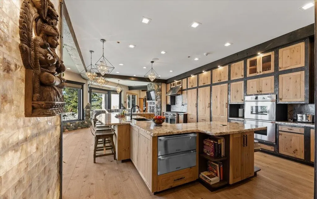 Former Home of a Rock and Roll Hall of Famer Above Lake Tahoe Lists for $43 Million 9 Chef’s kitchen at the Lake Tahoe estate featuring custom wood cabinetry, stone countertops and premium appliances