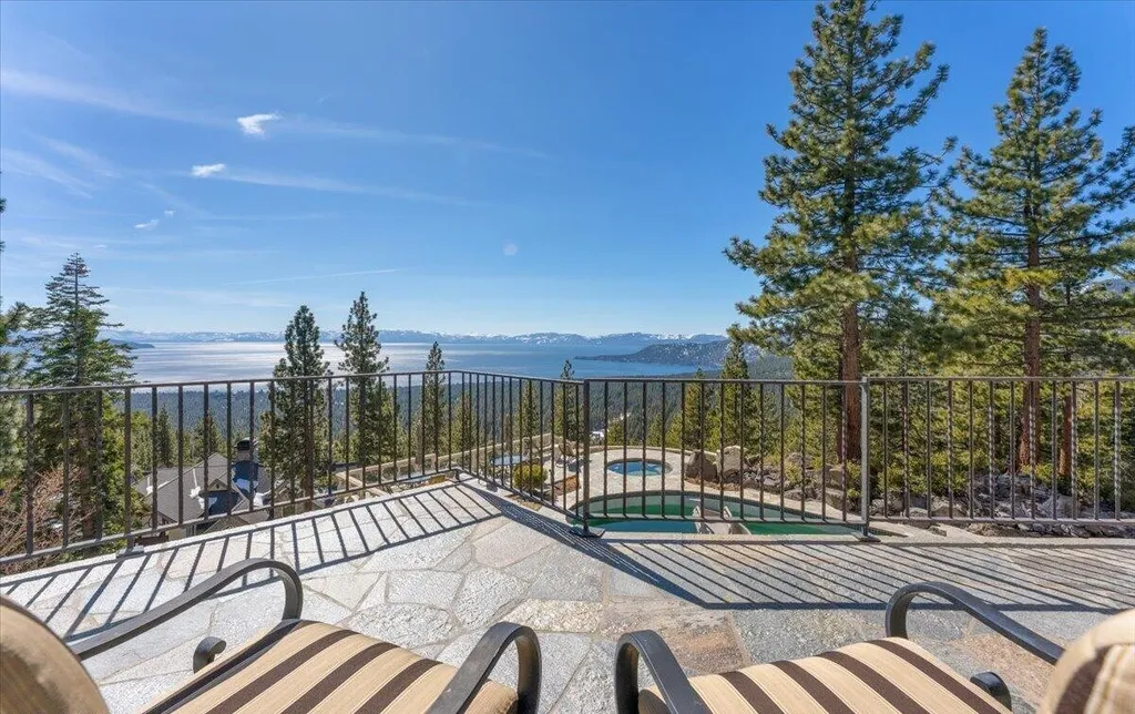 Former Home of a Rock and Roll Hall of Famer Above Lake Tahoe Lists for $43 Million 8 Private terrace at the Lake Tahoe estate featuring panoramic lake views, mountain scenery and outdoor lounge seating