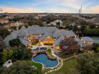 This $11.9 Million Plano Estate Occupies Former Willow Bend Polo Grounds and Spans Nearly Two Acres 2 Aerial view of the luxury estate at 6413 Old Gate Road in Plano Texas featuring resort-style pools, landscaped grounds and a private tennis court