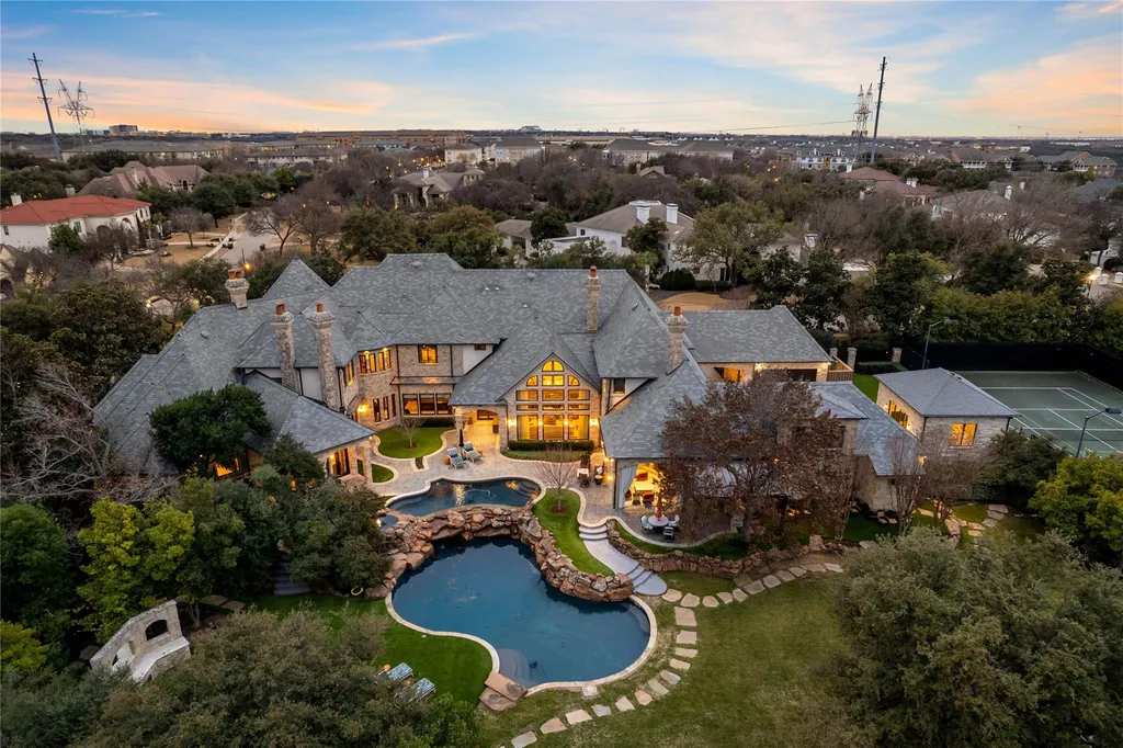 This $11.9 Million Plano Estate Occupies Former Willow Bend Polo Grounds and Spans Nearly Two Acres 1 Aerial view of the luxury estate at 6413 Old Gate Road in Plano Texas featuring resort-style pools, landscaped grounds and a private tennis court