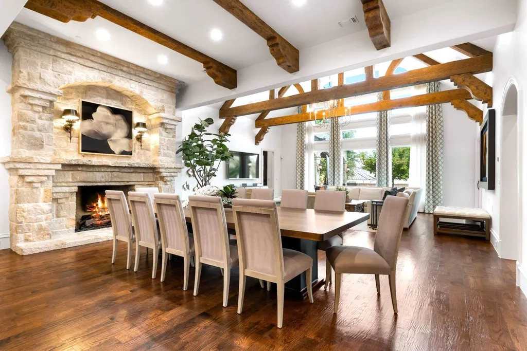 This $11.9 Million Plano Estate Occupies Former Willow Bend Polo Grounds and Spans Nearly Two Acres 7 Great room at the Kings Gate estate in Plano Texas featuring exposed timber beams, a grand limestone fireplace and soaring ceilings