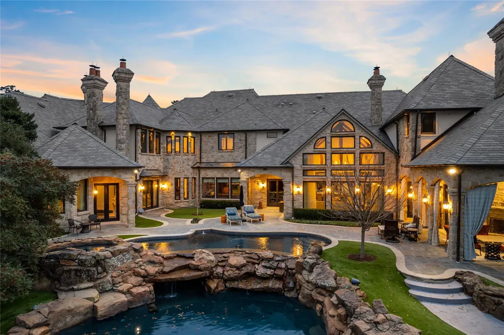 This $11.9 Million Plano Estate Occupies Former Willow Bend Polo Grounds and Spans Nearly Two Acres 2 Rear exterior of the Kings Gate luxury estate in Plano Texas featuring limestone architecture, resort-style pool and private courtyard
