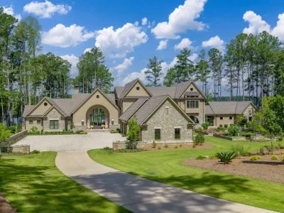 This $16 Million Georgia Lake House Sits on a Coveted Point Lot—with the Ritz-Carlton Across the Water 1 This $16 Million Georgia Lake House Sits on a Coveted Point Lot—with the Ritz-Carlton Across the Water