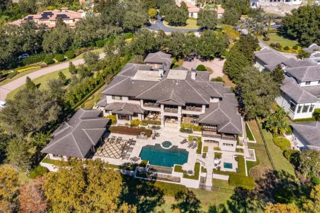 Elegant Isleworth Lakefront Estate With a Hidden Passage and Private Boat Dock Lists for $19,500,000