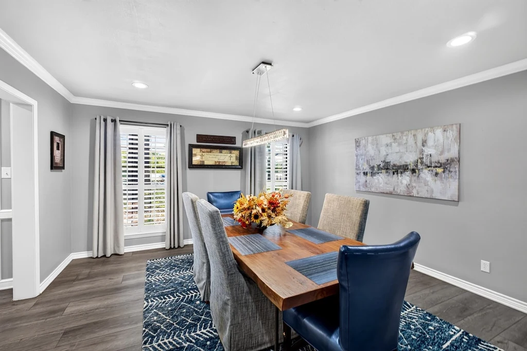 16104 County Road 294 – Formal Dining Room 16104 County Road 294, Arp: plantation shutters and crisp white trim frame the formal dining room.