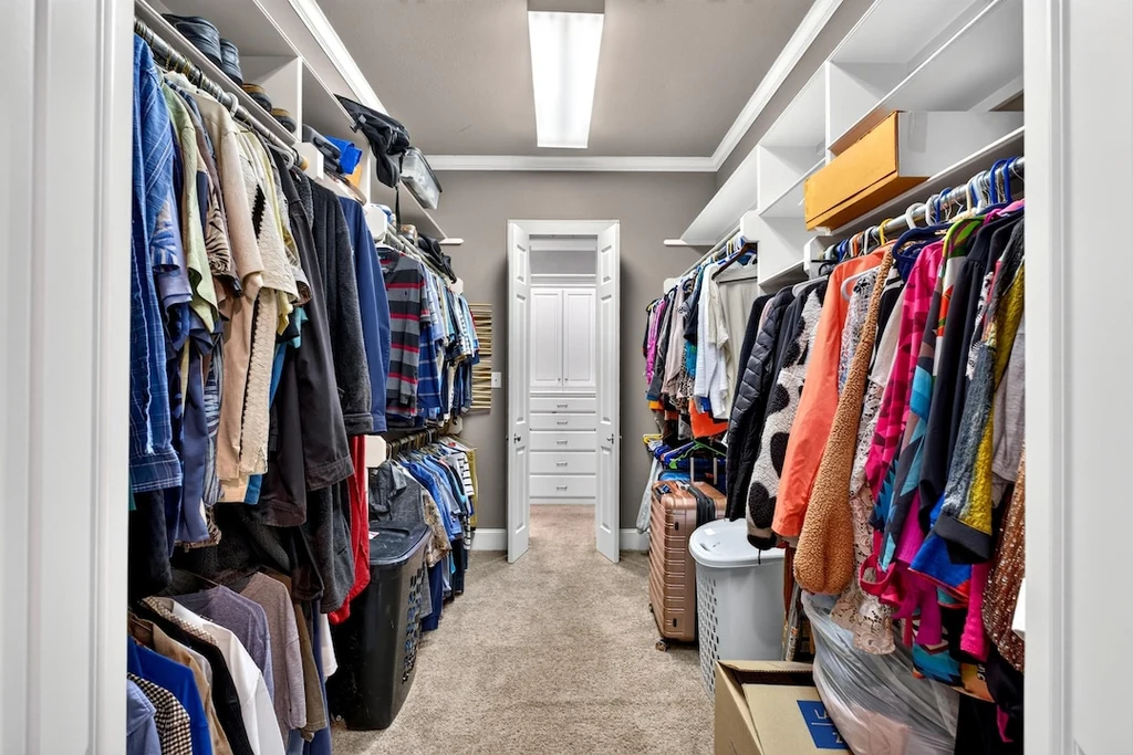 16104 County Road 294 – Walk Through Closet 16104 County Road 294, Arp: a long dressing room provides fitted hanging space and drawers.