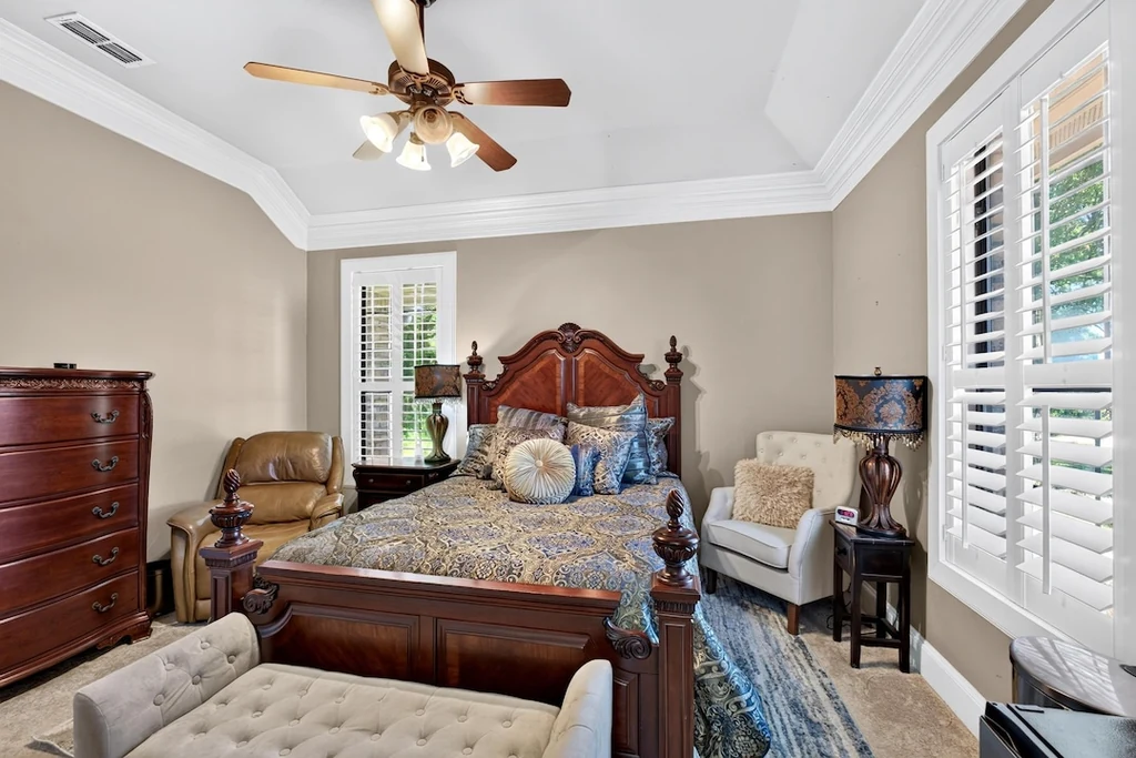 16104 County Road 294 – Guest Bedroom 16104 County Road 294, Arp: a guest bedroom pairs traditional furnishings with tall shuttered windows.