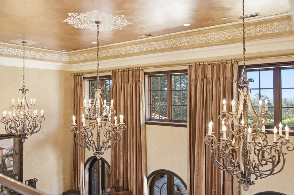 10285 Magdalena Rd – Decorative Ceiling 10285 Magdalena Rd, Los Altos Hills: decorative ceiling finishes and chandeliers add richness above the living room.