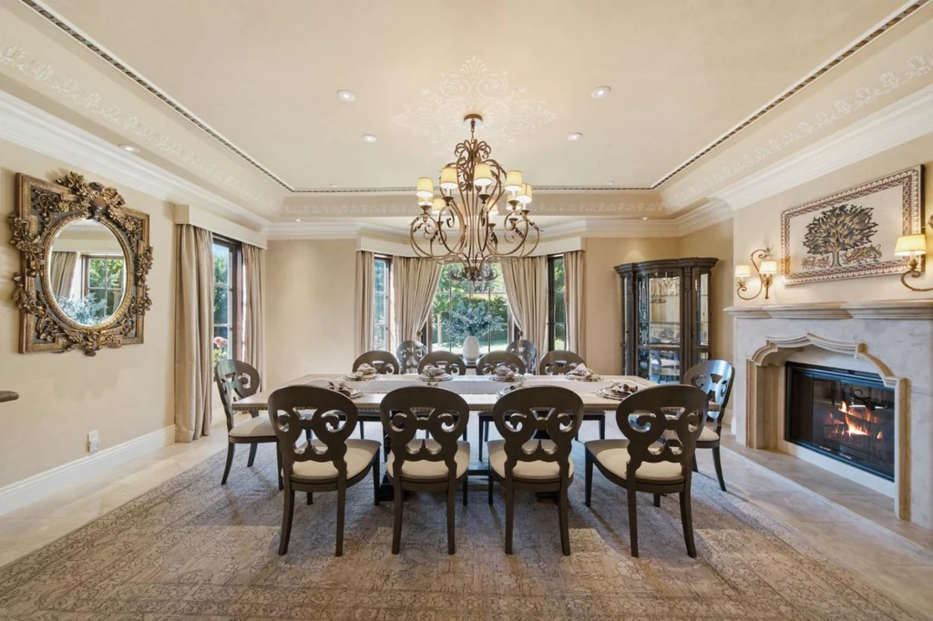 10285 Magdalena Rd – Formal Dining Room 10285 Magdalena Rd, Los Altos Hills: the formal dining room features a fireplace and access to the terrace.