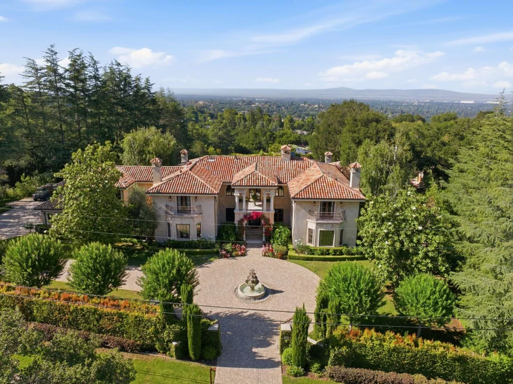 10285 Magdalena Rd – Front Aerial View 10285 Magdalena Rd, Los Altos Hills: the symmetrical entrance elevation overlooks a landscaped arrival court.