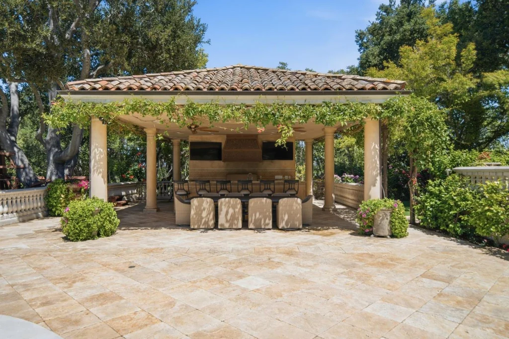 10285 Magdalena Rd – Poolside Cabana 10285 Magdalena Rd, Los Altos Hills: the poolside cabana includes a bar beneath a tiled roof.