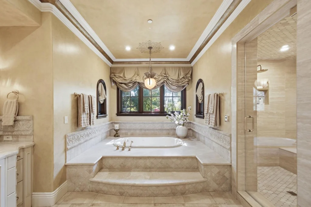 10285 Magdalena Rd – Primary Bathroom 10285 Magdalena Rd, Los Altos Hills: the primary bathroom features a raised bathtub and detailed stone finishes.
