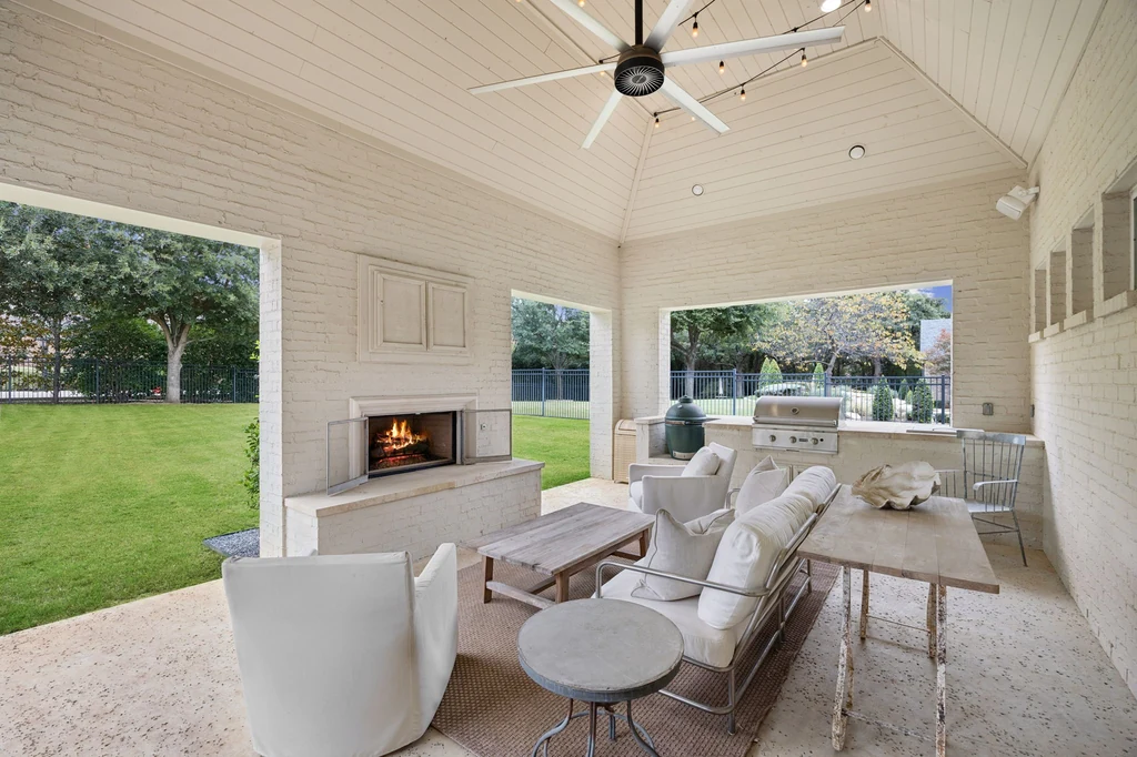 1255 Bolton Ct – Fireplace Loggia 1255 Bolton Ct, Southlake: a covered loggia brings together lounge seating, a fireplace and an outdoor cooking counter.