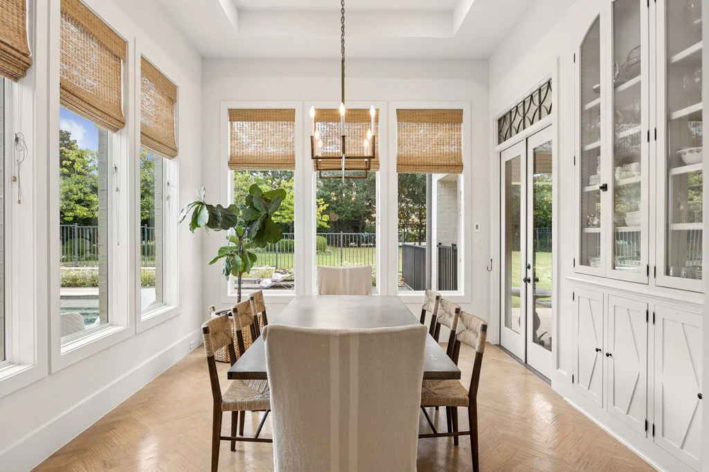 1255 Bolton Ct – Garden Facing Dining Room 1255 Bolton Ct, Southlake: windows and glass front cabinetry line the bright garden facing dining room.