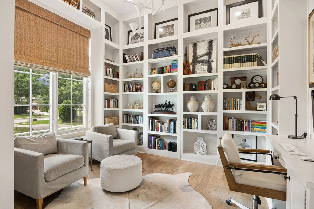 1255 Bolton Ct – Library Study 1255 Bolton Ct, Southlake: tall fitted bookshelves surround a quiet study with a built in desk.