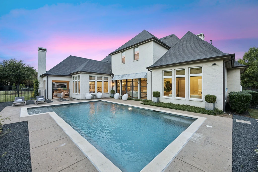 1255 Bolton Ct – Poolside Twilight 1255 Bolton Ct, Southlake: warm interior light reflects across the pool beneath a colorful twilight sky.