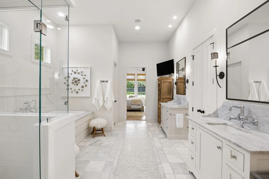 1255 Bolton Ct – Primary Bathroom 1255 Bolton Ct, Southlake: twin vanity areas and pale stone surfaces frame the spacious primary bathroom.